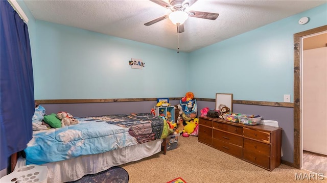 19954 Ironwood Ln, Lebanon, MO 65536 - bedroom with a textured ceiling, carpet, and a ceiling fan