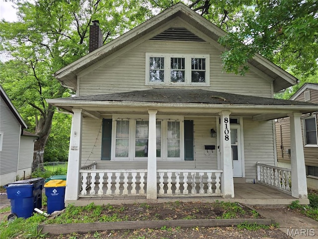 8108 Saint Charles Rock Rd, Saint Louis, MO 63114 - view of front of property with a porch and a chimney