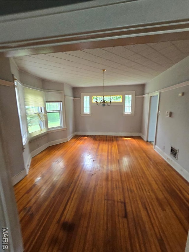 8108 Saint Charles Rock Rd, Saint Louis, MO 63114 - unfurnished room featuring a chandelier and hardwood / wood-style floors