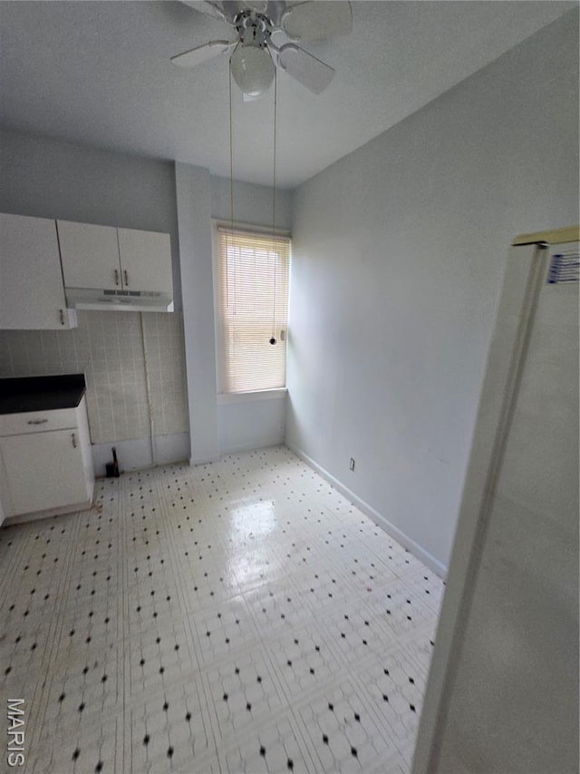 8108 Saint Charles Rock Rd, Saint Louis, MO 63114 - unfurnished dining area featuring ceiling fan and baseboards