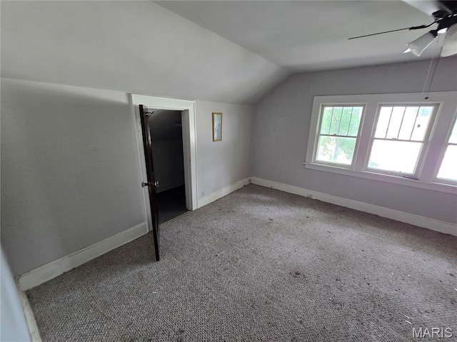 8108 Saint Charles Rock Rd, Saint Louis, MO 63114 - additional living space with vaulted ceiling, a ceiling fan, and carpet flooring
