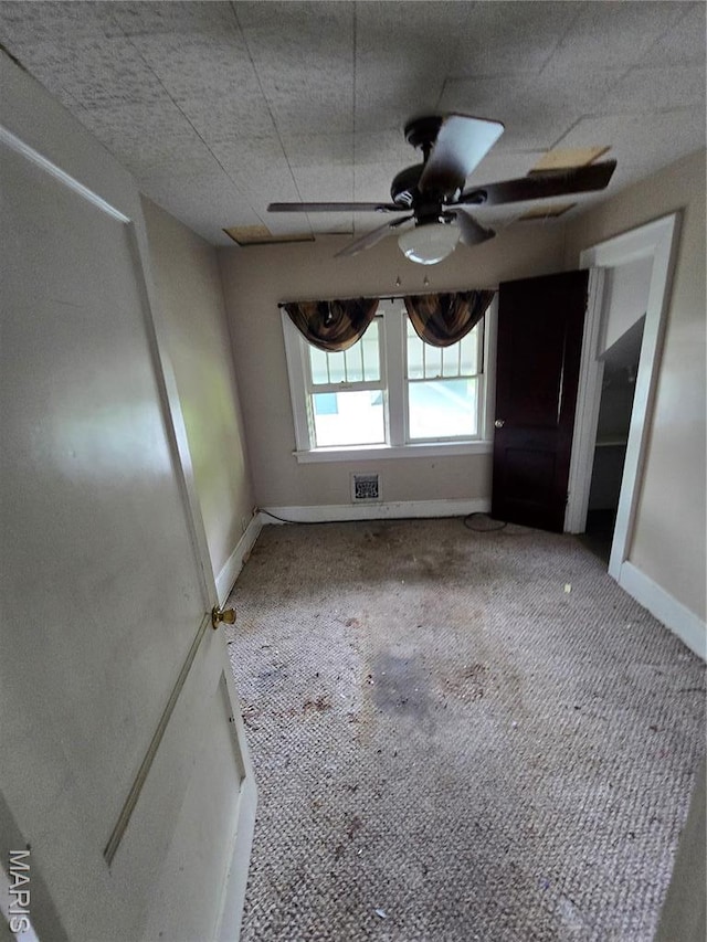 8108 Saint Charles Rock Rd, Saint Louis, MO 63114 - spare room featuring ceiling fan and carpet floors
