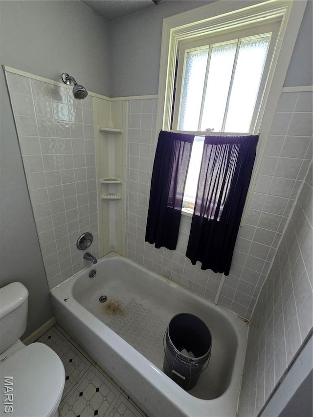 8108 Saint Charles Rock Rd, Saint Louis, MO 63114 - bathroom featuring tile patterned flooring, tile walls, and tub / shower combination