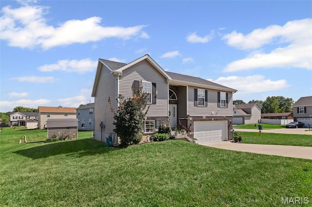 101 Shiloh Ridge Dr, Shiloh, IL 62221 - raised ranch with concrete driveway, a front yard, an attached garage, and a residential view