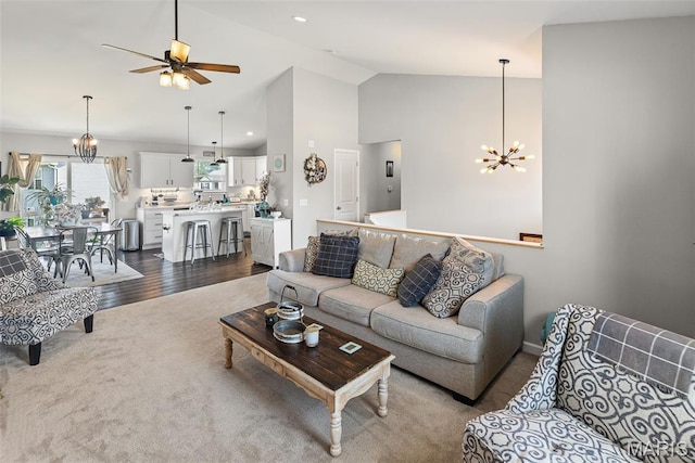 101 Shiloh Ridge Dr, Shiloh, IL 62221 - living room with a chandelier, dark colored carpet, a ceiling fan, and high vaulted ceiling