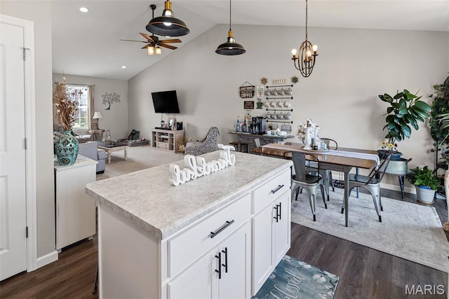 101 Shiloh Ridge Dr, Shiloh, IL 62221 - kitchen with dark wood-type flooring, vaulted ceiling, a kitchen island, white cabinets, and ceiling fan