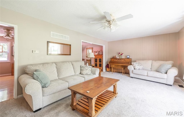 15550 US Highway 63, Rolla, MO 65401 - living area featuring ceiling fan and light colored carpet