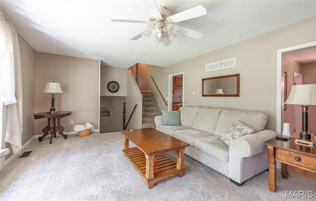 15550 US Highway 63, Rolla, MO 65401 - living room featuring a ceiling fan, carpet, and stairway