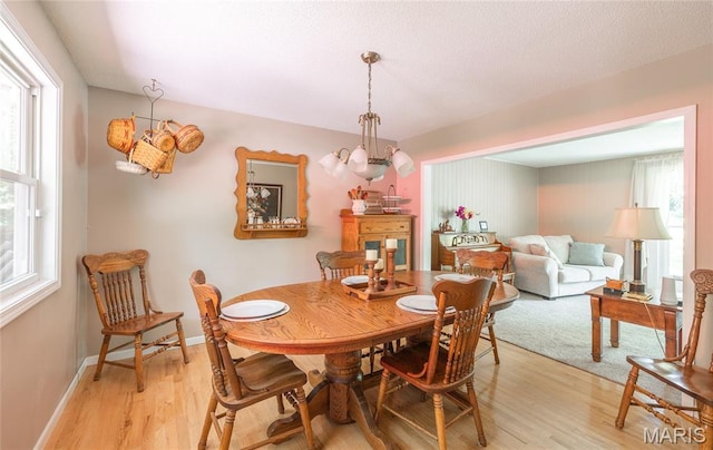 15550 US Highway 63, Rolla, MO 65401 - dining space featuring light wood finished floors and a chandelier
