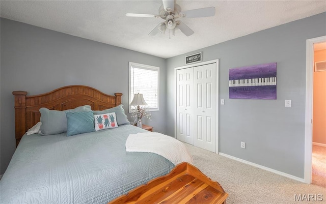 15550 US Highway 63, Rolla, MO 65401 - carpeted bedroom with a closet, a ceiling fan, and a textured ceiling