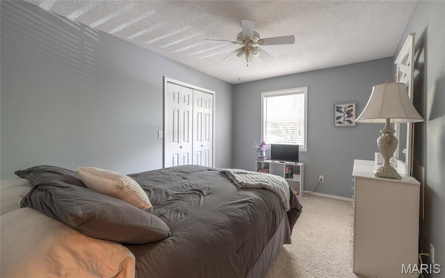 15550 US Highway 63, Rolla, MO 65401 - bedroom featuring light carpet, a closet, a ceiling fan, and a textured ceiling