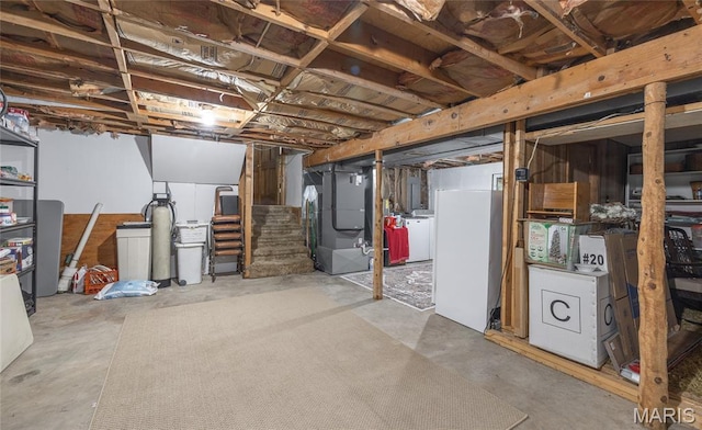 15550 US Highway 63, Rolla, MO 65401 - unfinished below grade area with a water softener system, stairway, heating unit, and washing machine and clothes dryer