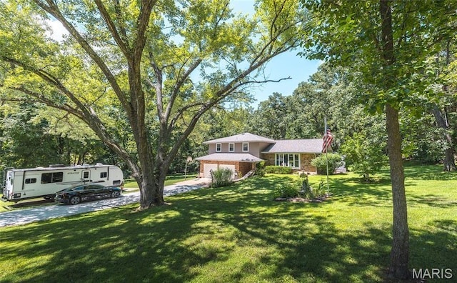 15550 US Highway 63, Rolla, MO 65401 - split level home featuring driveway, a garage, and a front lawn