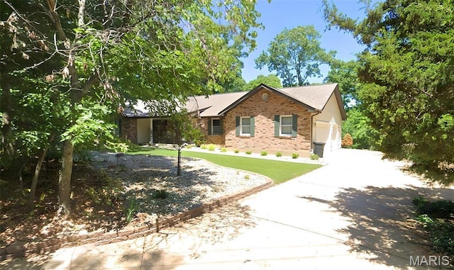 67 High Trails Dr, Eureka, MO 63025 - view of front facade with brick siding, an attached garage, and driveway
