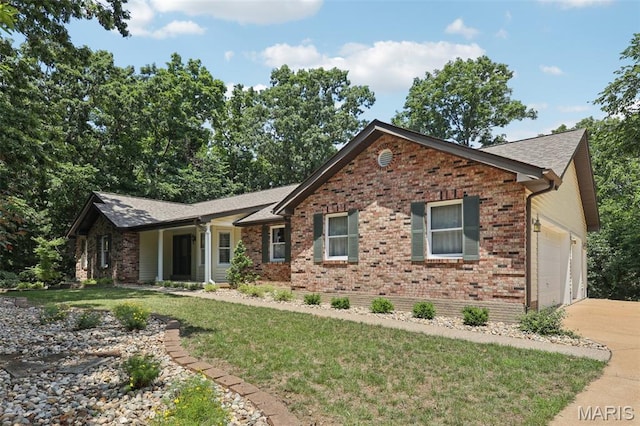 67 High Trails Dr, Eureka, MO 63025 - ranch-style house with brick siding, concrete driveway, an attached garage, a front lawn, and roof with shingles
