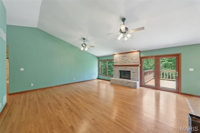 67 High Trails Dr, Eureka, MO 63025 - unfurnished living room featuring a ceiling fan, light wood-type flooring, vaulted ceiling, and a fireplace