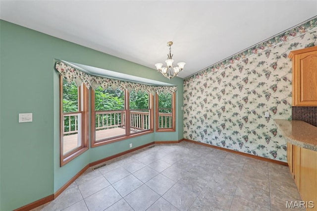 67 High Trails Dr, Eureka, MO 63025 - unfurnished dining area featuring a chandelier and wallpapered walls