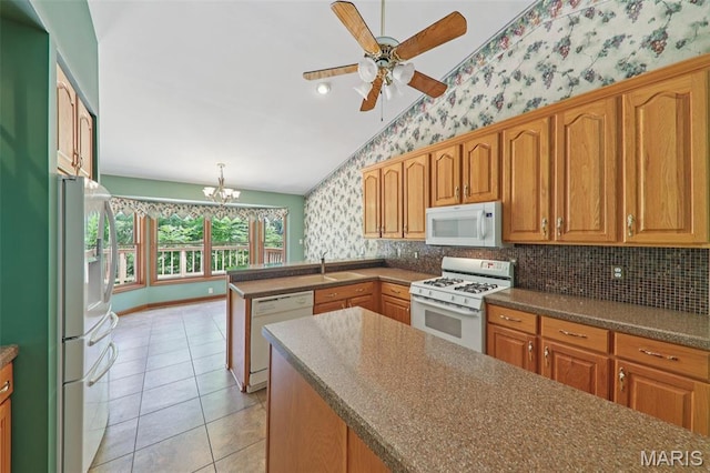 67 High Trails Dr, Eureka, MO 63025 - kitchen featuring white appliances, wallpapered walls, a peninsula, a ceiling fan, and a chandelier