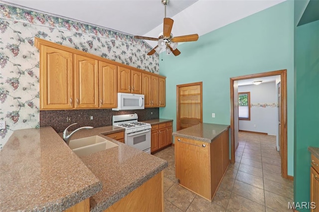 67 High Trails Dr, Eureka, MO 63025 - kitchen featuring white appliances, a ceiling fan, decorative backsplash, wallpapered walls, and light tile patterned floors