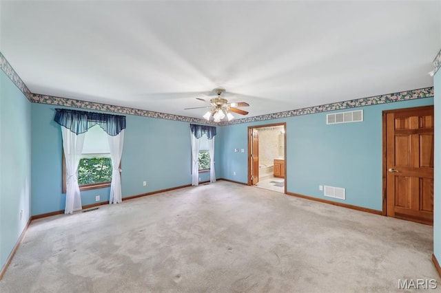 67 High Trails Dr, Eureka, MO 63025 - unfurnished bedroom featuring multiple windows, carpet floors, ensuite bath, and ceiling fan