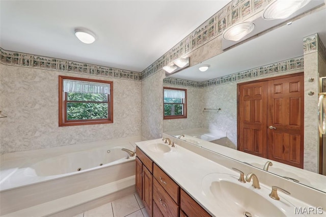 67 High Trails Dr, Eureka, MO 63025 - full bathroom with a tub with jets, double vanity, wallpapered walls, and tile patterned floors