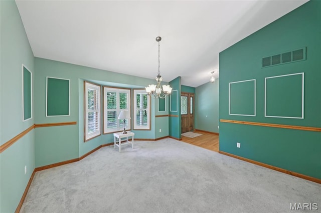 67 High Trails Dr, Eureka, MO 63025 - spare room featuring carpet floors, plenty of natural light, and a chandelier