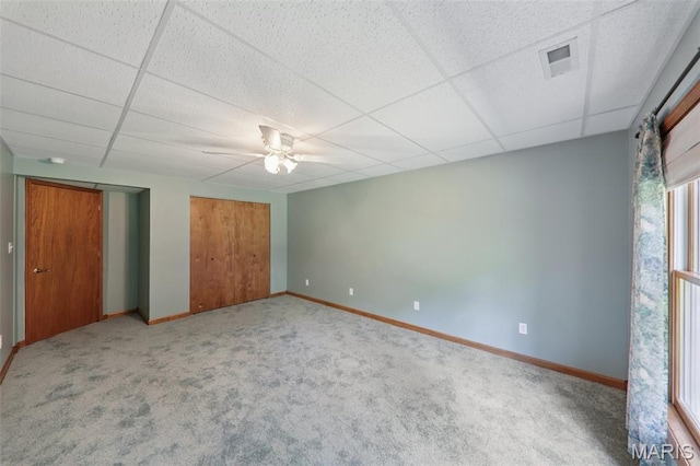 67 High Trails Dr, Eureka, MO 63025 - unfurnished bedroom featuring carpet floors, a drop ceiling, multiple windows, and ceiling fan