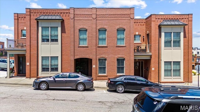 9 E Main St, Washington, MO 63090 - view of property featuring brick siding