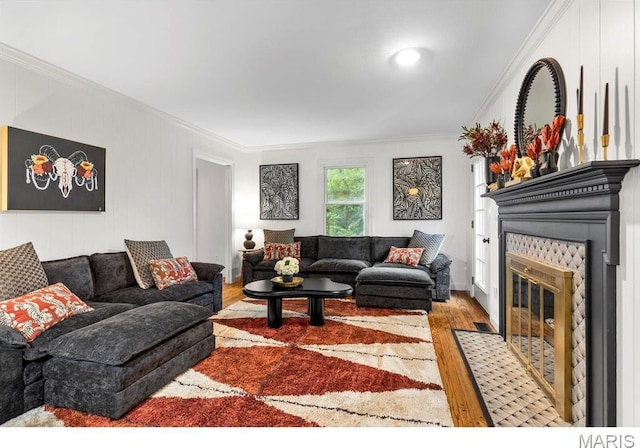 1855 Grassy Ridge Rd, Kirkwood, MO 63122 - living room featuring ornamental molding, a fireplace with flush hearth, and wood finished floors