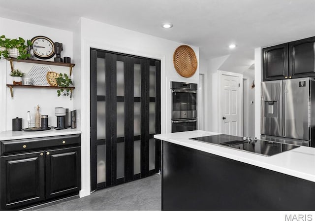 1855 Grassy Ridge Rd, Kirkwood, MO 63122 - kitchen with appliances with stainless steel finishes, dark cabinetry, light countertops, open shelves, and recessed lighting