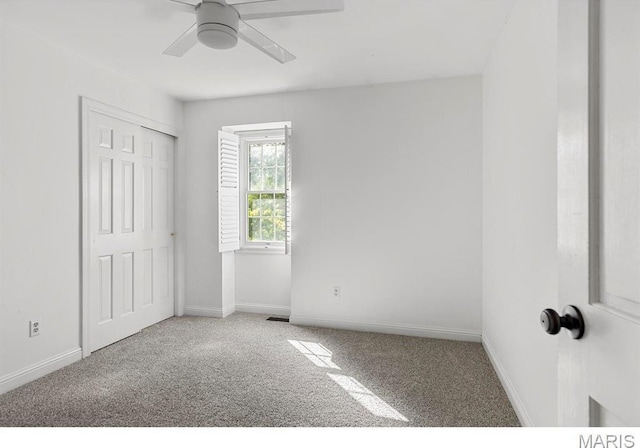 1855 Grassy Ridge Rd, Kirkwood, MO 63122 - unfurnished bedroom featuring carpet, ceiling fan, and a closet