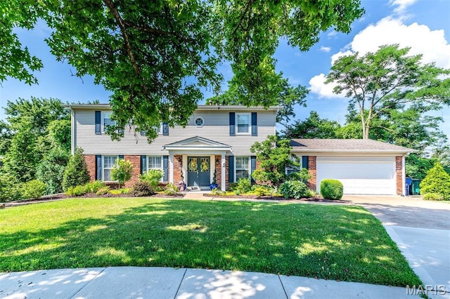 2211 Viewroyal Dr, Des Peres, MO 63131 - colonial-style house featuring brick siding, driveway, a front lawn, and a garage