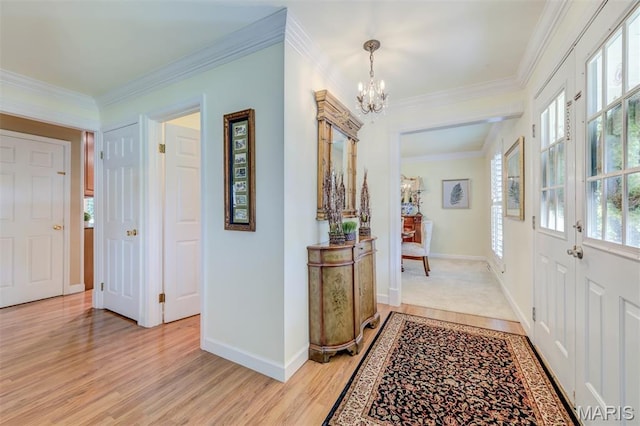 2211 Viewroyal Dr, Des Peres, MO 63131 - entryway with a chandelier, healthy amount of natural light, crown molding, and light wood finished floors