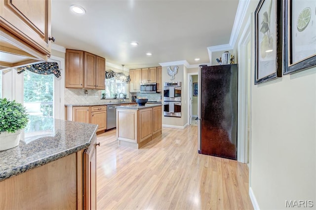 2211 Viewroyal Dr, Des Peres, MO 63131 - kitchen featuring appliances with stainless steel finishes, ornamental molding, backsplash, light wood-style floors, and a center island