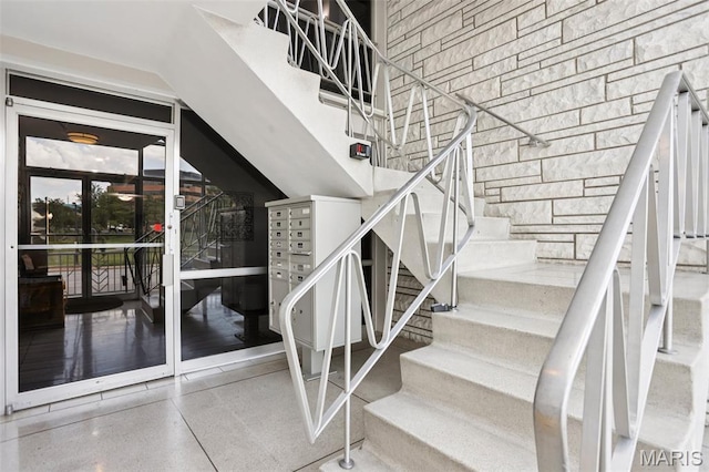 520 S Brentwood Blvd Unit 3A, Saint Louis, MO 63105 - stairs with speckled floor