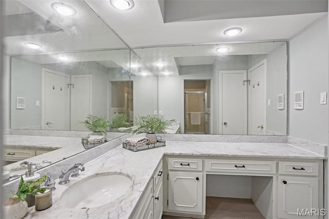 520 S Brentwood Blvd Unit 3A, Saint Louis, MO 63105 - bathroom featuring a stall shower, vanity, and tile patterned flooring