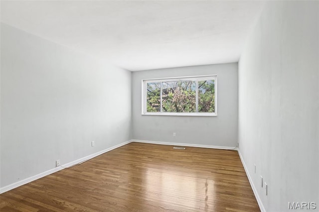 520 S Brentwood Blvd Unit 3A, Saint Louis, MO 63105 - unfurnished room with wood finished floors and baseboards