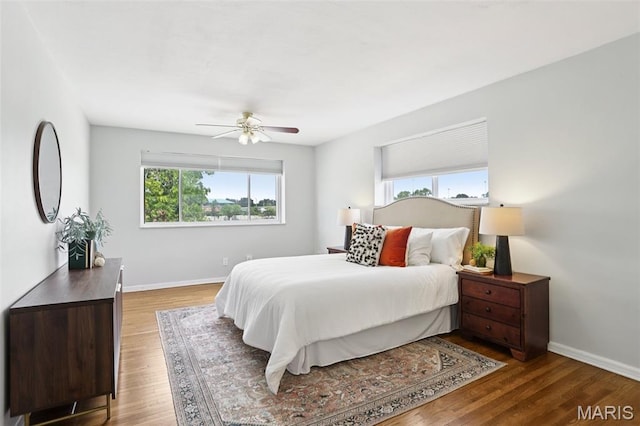 520 S Brentwood Blvd Unit 3A, Saint Louis, MO 63105 - bedroom featuring wood finished floors and ceiling fan