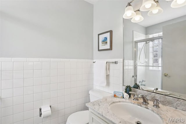 520 S Brentwood Blvd Unit 3A, Saint Louis, MO 63105 - bathroom with tile walls, a shower stall, vanity, and a chandelier