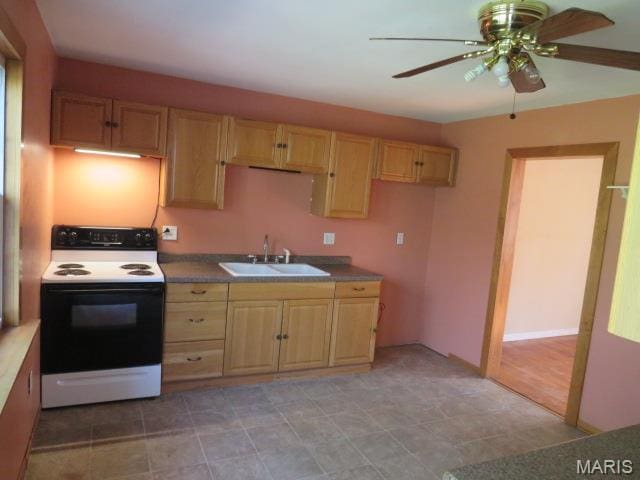 5129 Rapp Rd, Granite City, IL 62040 - kitchen with electric stove, light brown cabinets, and a ceiling fan