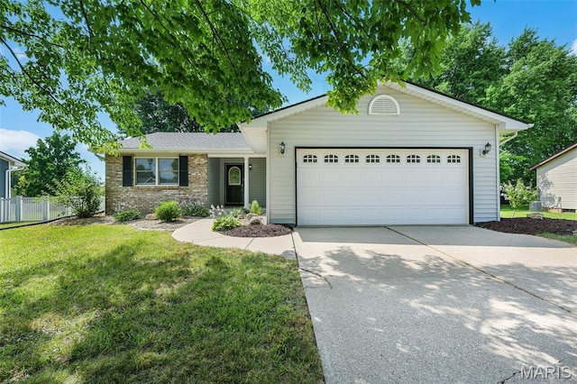1016 Andra Dr, Maryville, IL 62062 - ranch-style house featuring concrete driveway and an attached garage