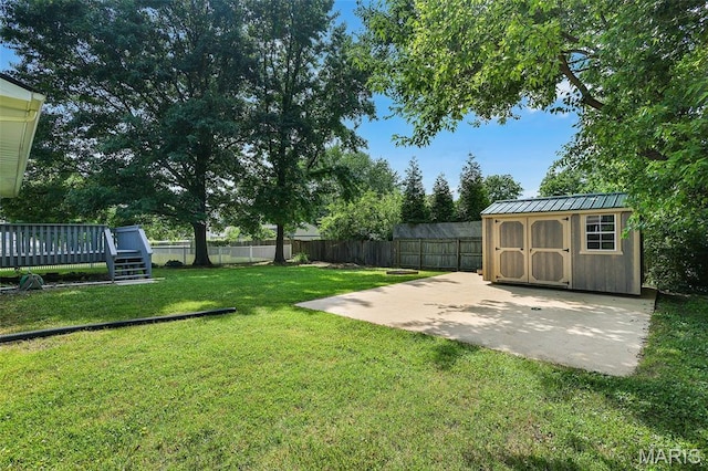 1016 Andra Dr, Maryville, IL 62062 - fenced backyard with a storage shed, a patio area, and a wooden deck