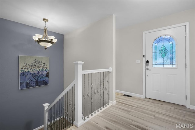 1016 Andra Dr, Maryville, IL 62062 - entrance foyer with a chandelier and wood finished floors