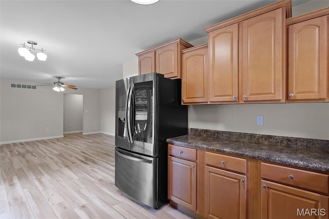 1016 Andra Dr, Maryville, IL 62062 - kitchen featuring stainless steel fridge with ice dispenser, a ceiling fan, and light wood-style flooring