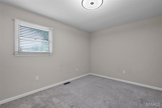 1016 Andra Dr, Maryville, IL 62062 - carpeted spare room with baseboards and a textured ceiling