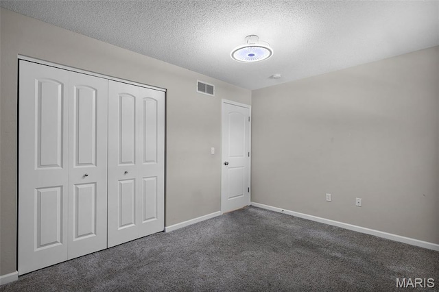 1016 Andra Dr, Maryville, IL 62062 - unfurnished bedroom featuring carpet flooring, a closet, and a textured ceiling