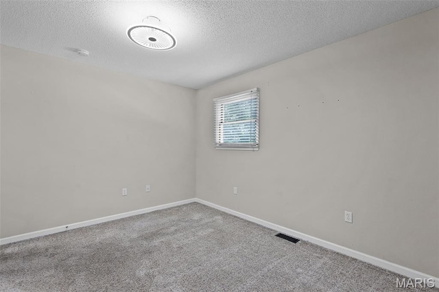 1016 Andra Dr, Maryville, IL 62062 - carpeted empty room featuring a textured ceiling and a smoke detector