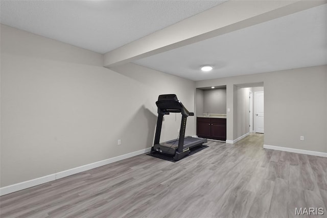 1016 Andra Dr, Maryville, IL 62062 - exercise area featuring light wood-style floors and baseboards