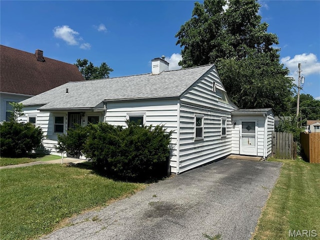 1325 Orchard St, Belleville, IL 62221 - view of front of property with roof with shingles and a chimney