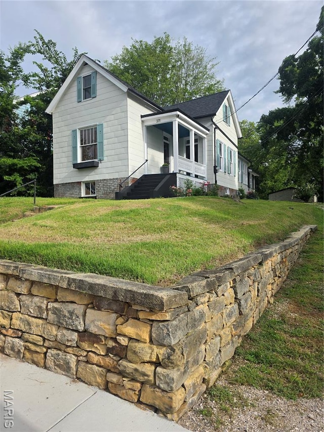 371 Jefferson St, Saint Genevieve, MO 63670 - view of front of home with a front yard and covered porch